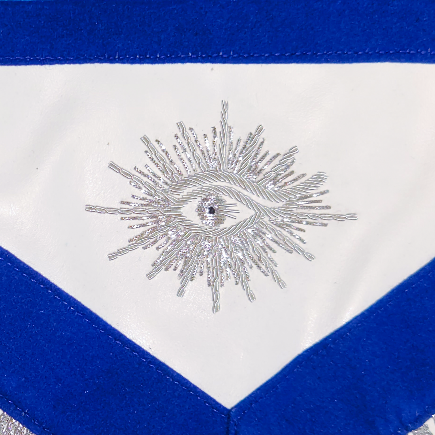 Close-up of the silver bullion embroidery on the apron’s All-Seeing Eye and Masonic symbols